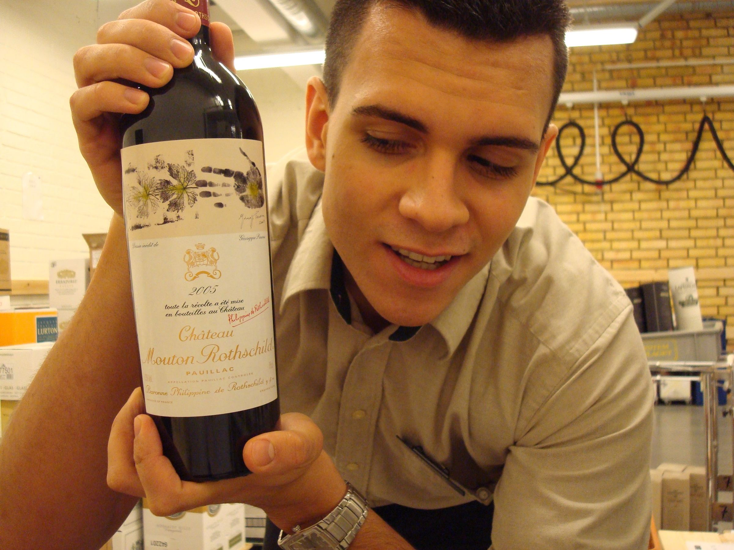 Cruz with a bottle of 2005 Ch&acirc;teau Mouton Rothschild at Systembolaget
